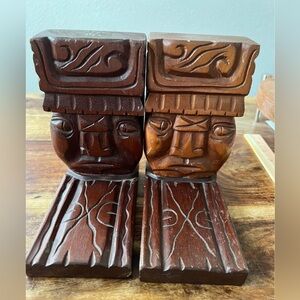 Carved wooden tiki bookends 
Made In Honduras